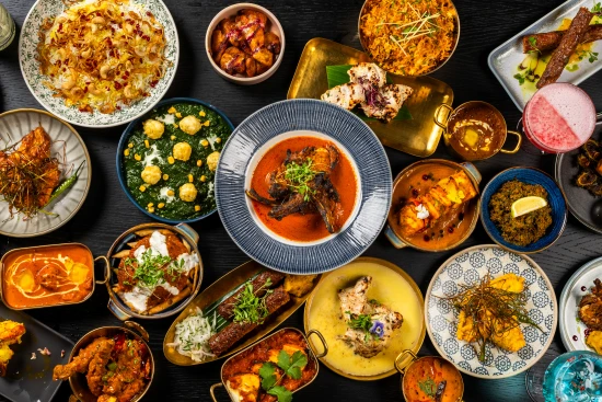 An array of Indian dishes spread on a table