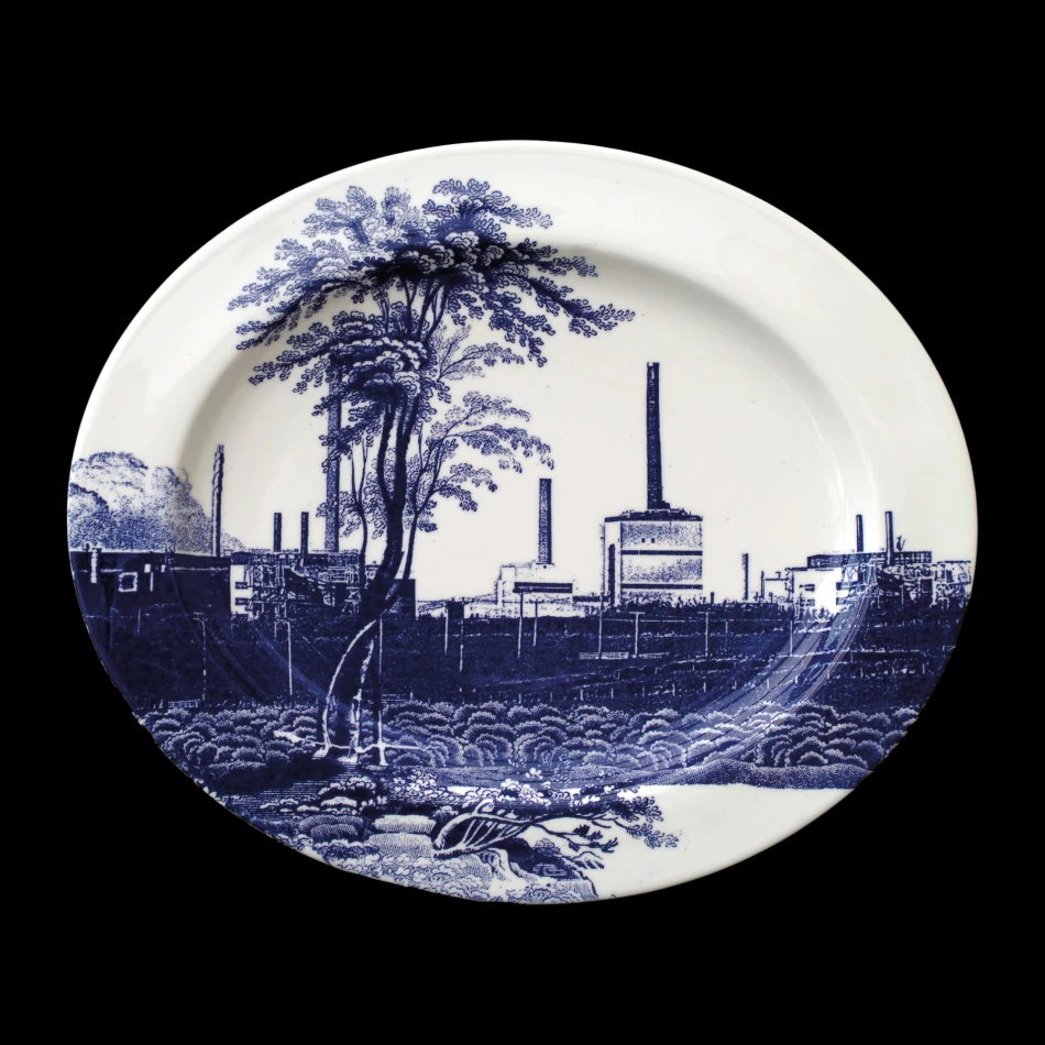 Image: Cumbrian Blue(s), Sellafield No:9, 5/5. Transfer print collage on bone china platter with platinum, 410mm x 345mm x 24mm. Paul Scott 2005.