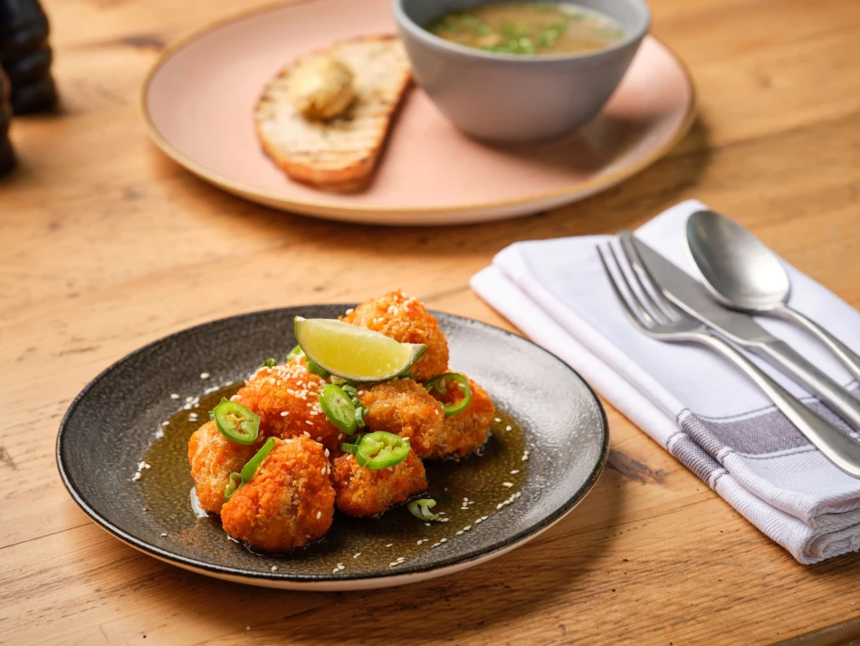 A plate of sticky bang bang cauliflower at Social Bird